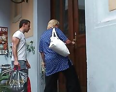Busty blonde granny sates young mendicant for help