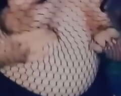 Playing with my tits in a fishnet shirt and tiny shorts