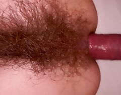 Slim super hairy MILF does anal and sprays a in the midst